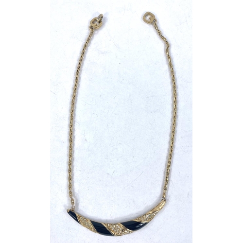 694 - A 2 tone circular metal pendant, stamped '375', 2.3gm; a fine yellow metal chain, stamped '750', 3.1... 