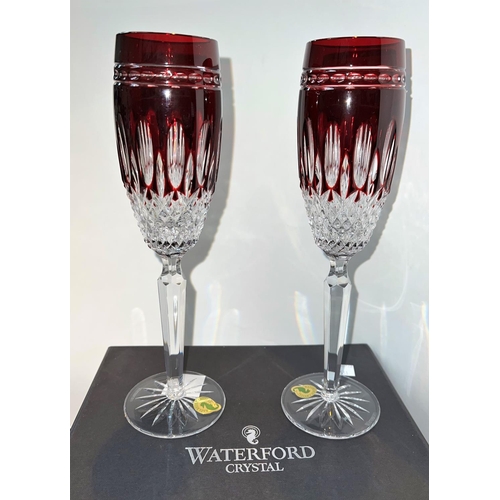 531 - A boxed pair of Waterford overlaid and cut glass ruby champagne