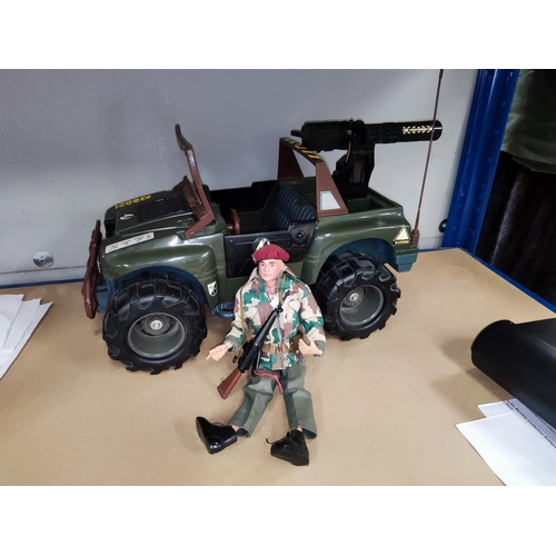 260b - A vintage Action Man in full camo and a later Action Man vehicle