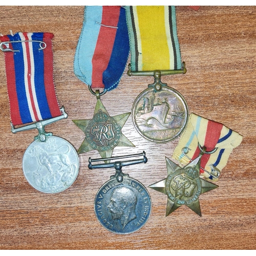 399 - Andrew chesnut: two WWI medals, one being a Mercantile Marine Medal and three WWII medals, including... 