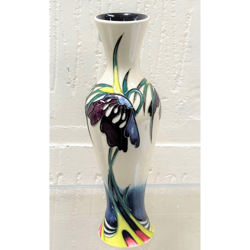 428 - A modern Moorcroft slender baluster vase 'Perisphore' decorated with purple flowers against a white ... 