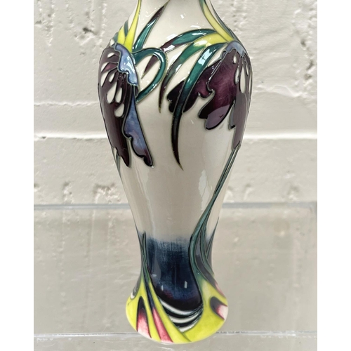 428 - A modern Moorcroft slender baluster vase 'Perisphore' decorated with purple flowers against a white ... 