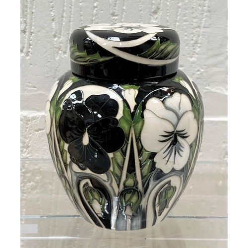 431 - A modern Moorcroft covered ginger jar 'Harliquinade' pattern, decorated with black and white pansies... 