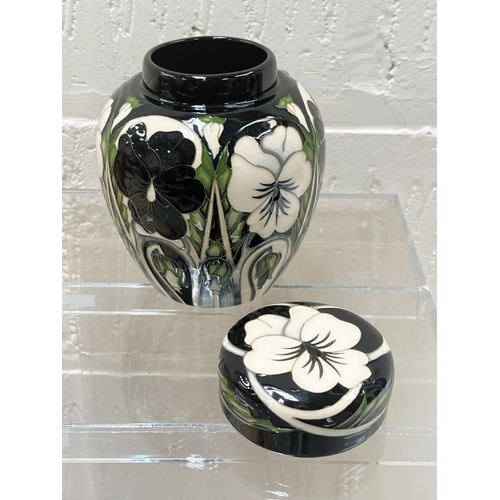 431 - A modern Moorcroft covered ginger jar 'Harliquinade' pattern, decorated with black and white pansies... 