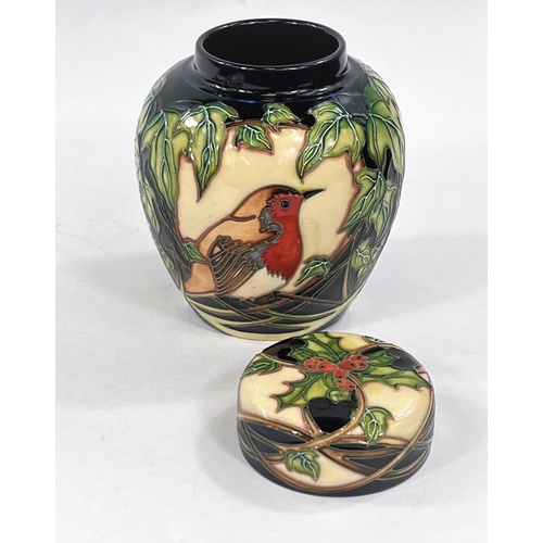 432 - A modern Moorcroft covered ginger jar 'Robin' decorated with robins on leafy branches, with holly an... 