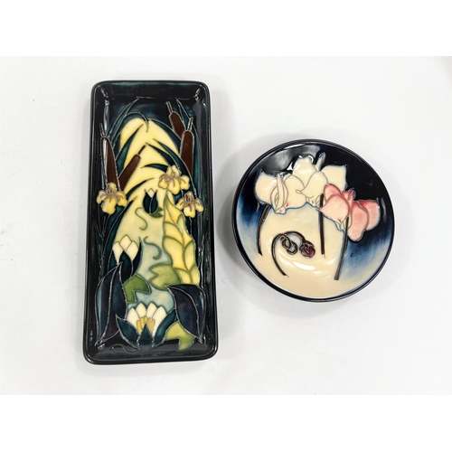 435 - A modern Moorcroft rectangular pen tray 'Lamia' pattern, decorated with flowers and bulrushes agains... 