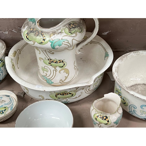 532 - An Art Nouveau pottery toilet set, 6 pieces