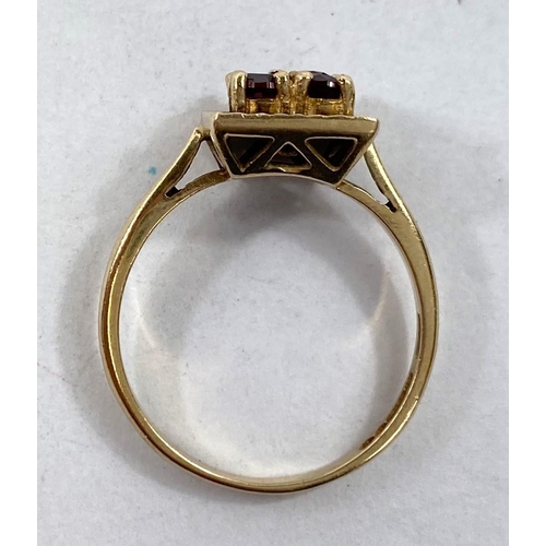 612 - A 9 carat gold dress ring with square red stone setting, 2.8gms.