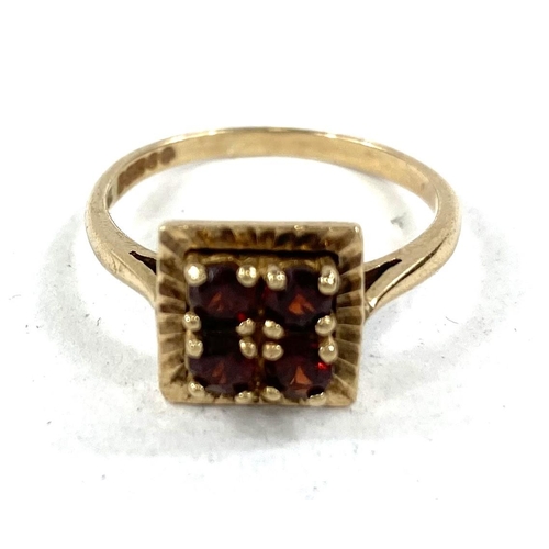 612 - A 9 carat gold dress ring with square red stone setting, 2.8gms.