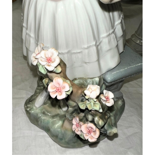 497 - A large Lladro group - girl picking flowers, height 30cms