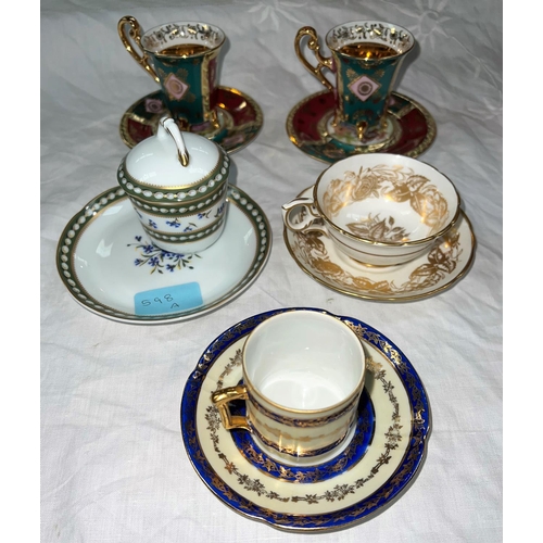 598A - A Hammersley Rose Point cup and saucer; a Royal Limoges chocolate cup and saucer; a pair of Bavaria ... 