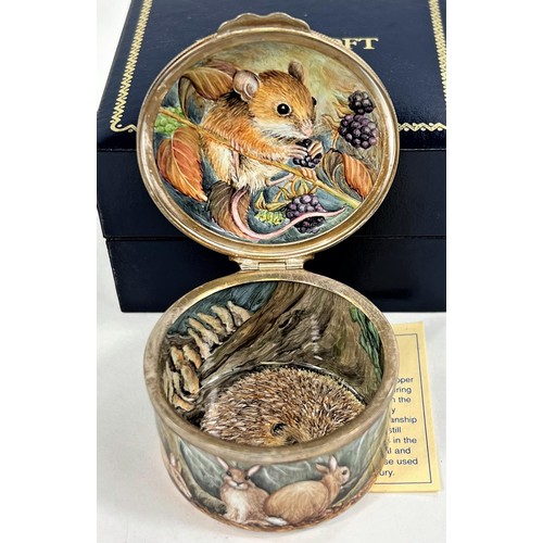 439b - A Moorcroft enamel hand painted pill box decorated with fox, hedgehog and other animals, trial piece... 