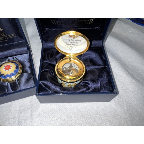 439C - Two Royal Worcester enamel boxes with integral clocks commemorating the Millennium, boxed