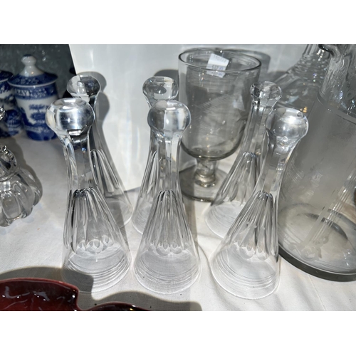 537B - A cut-glass claret jug: two decanters, a set of 6 stirrup/toasting glasses; 2 19th century copper lu... 