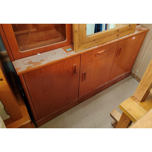 842 - A 20th century teak G-Plan sideboard with three cupboards and single drawer, length 132cm