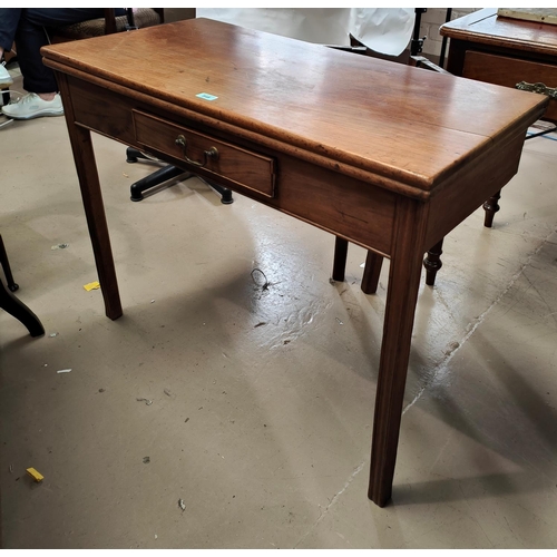 848 - A Georgian mahogany fold over tea table on square waive moulded legs A Victorian beech armchair with... 