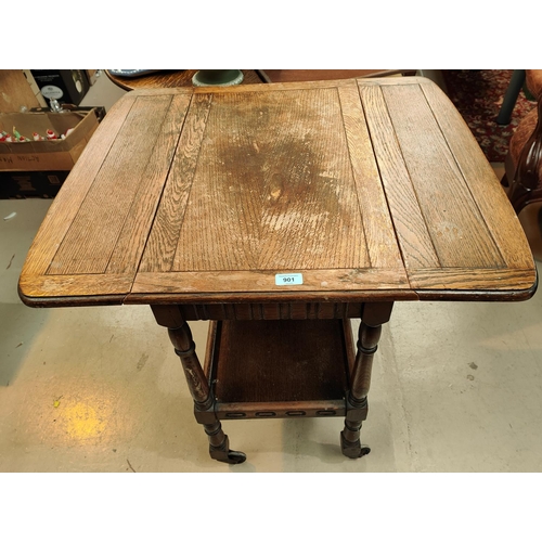 901 - A Jacobean style, oak, drop leaf, two tier Tea Trolley; a rectangular oak coffee table; a pink woven... 