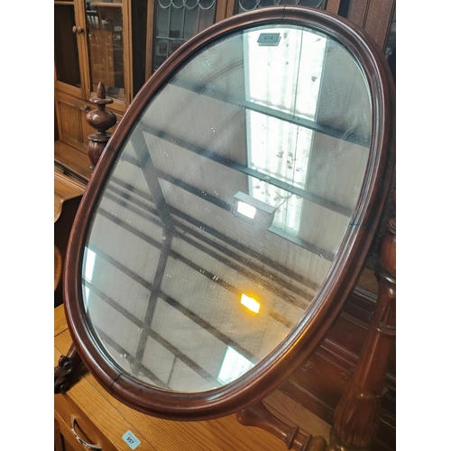 974 - A large mahogany framed, Victorian, oval  dressing table mirror.