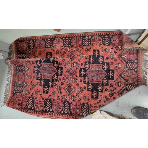 982 - A rust ground hand knotted Persian rug