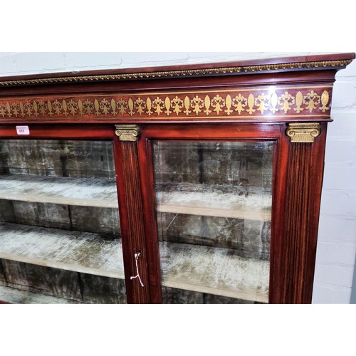 977 - A French Empire Style Side Table with Vitrine Cabinet, applied ormolu mounts and inlaid brass frieze... 