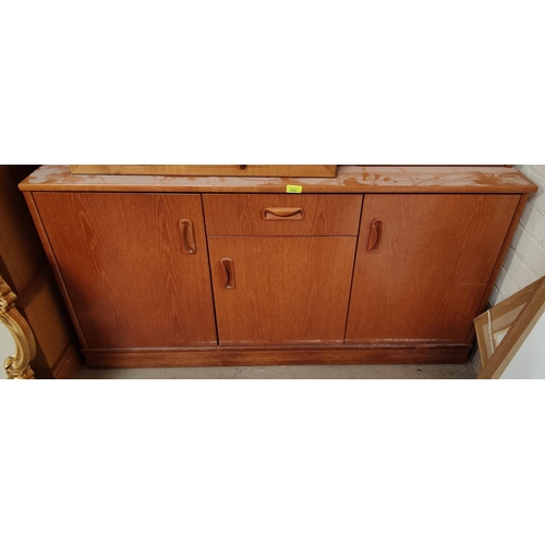 967 - A 20th century teak G-Plan sideboard with three cupboards and single drawer, length 132cm