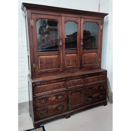 960 - A mid 18th century oak country made dresser/press cupboard with moulded and dentil cornice, the uppe... 