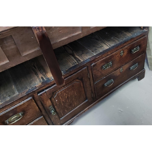 960 - A mid 18th century oak country made dresser/press cupboard with moulded and dentil cornice, the uppe... 