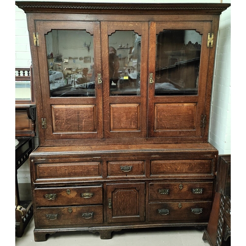 960 - A mid 18th century oak country made dresser/press cupboard with moulded and dentil cornice, the uppe... 