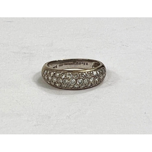 606A - An 18 carat gold half eternity ring with 3 rows of diamonds, approximately 43 diamonds in total, 4.2... 