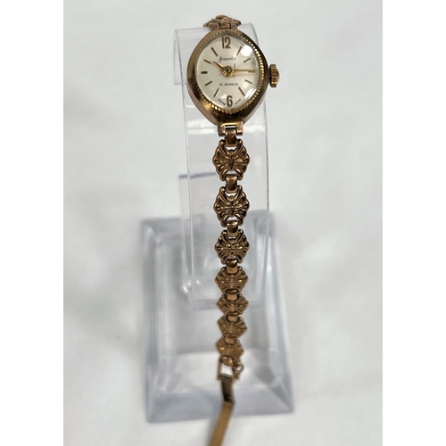 606B - A 9 carat gold lady's Accurist wristwatch with 9 carat gold case and similar floral strap, gross wei... 