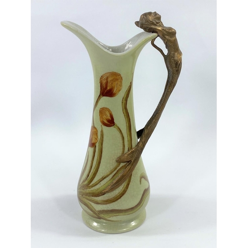 508A - J.B.T. ANNO 1906, Art Nuveau style ceramic jug with brass mermaid handle, height 23cm.