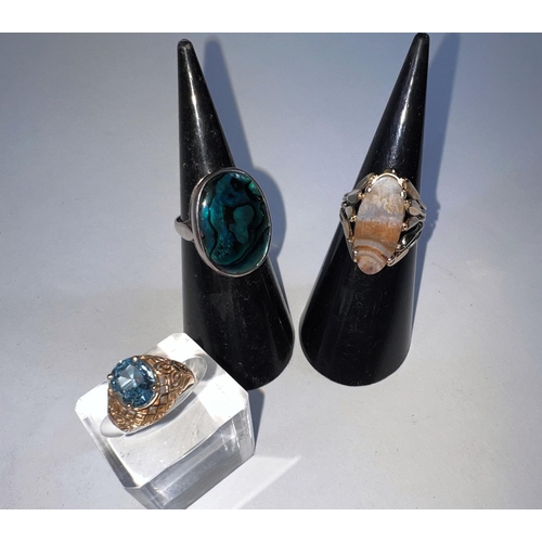 617 - A hallmarked silver lady's dress ring set with oval abalone shell; 2 yellow metal rings, 1 set with ... 