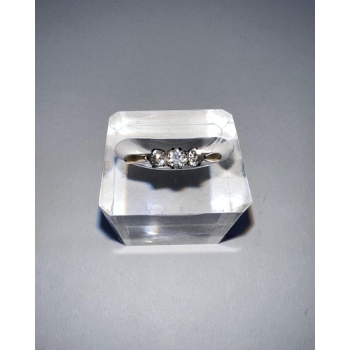 640 - A yellow metal dress ring stamped ‘18ct’ set 3 small diamonds (central stone approximately •1 carat)... 