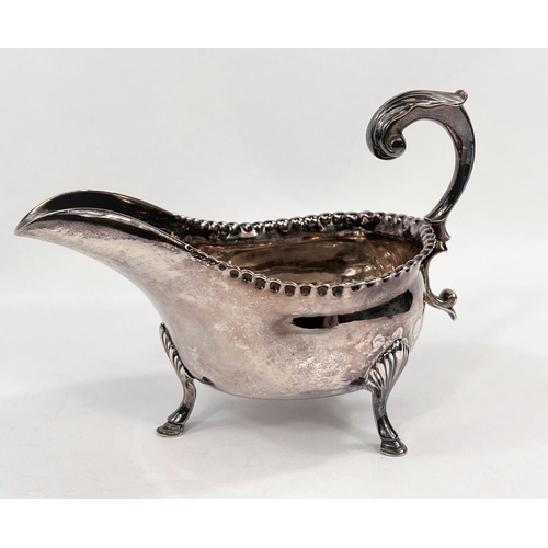 713 - A Georgian hallmarked silver sauce boat with beaded rim, 'C' scroll handle and hoof feet, Newcastle ... 