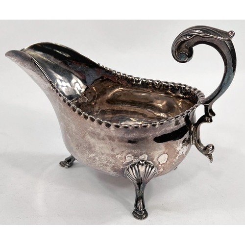 713 - A Georgian hallmarked silver sauce boat with beaded rim, 'C' scroll handle and hoof feet, Newcastle ... 