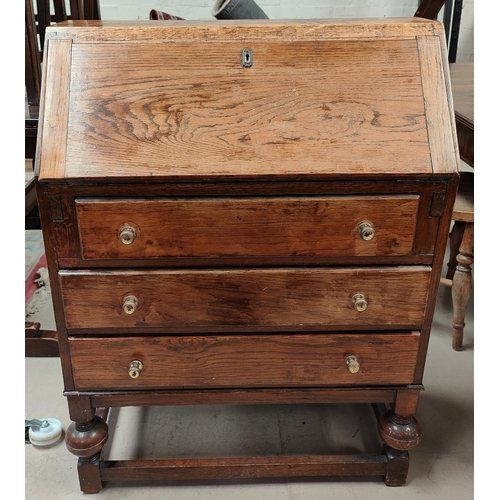 1008 - A reproduction oak fall front bureau with 3 drawers