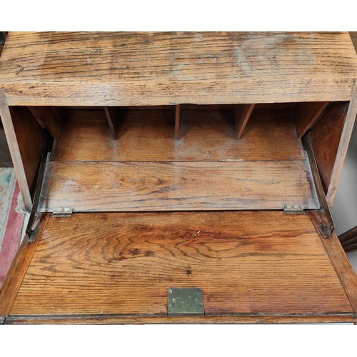 1008 - A reproduction oak fall front bureau with 3 drawers