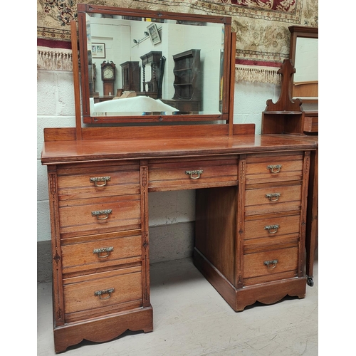 1009 - A late Victorian/Edwardian dressing chest of 9 drawers with swan neck handles and mirror