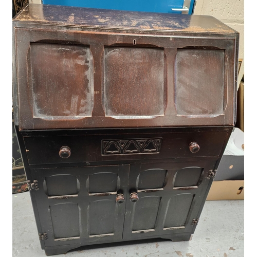 1021 - An oak Jacobean style bureau with drawers bellow fall front 