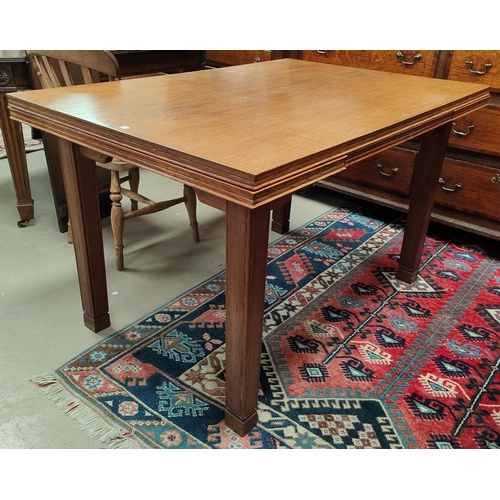 1022 - An good quality oak Cotswold's draw leaf dining table with squared tapering legs, beaded stepped edg... 