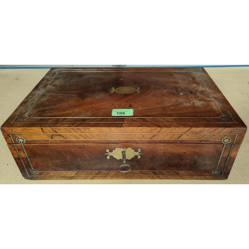 106 - A Victorian lap desk in crossbanded walnut and rosewood, with extensive brass inlay and fitted inter... 