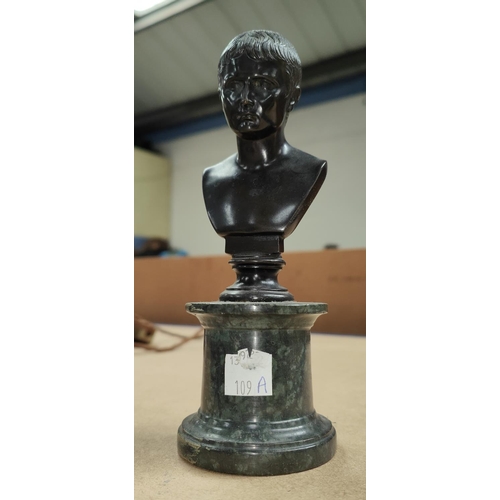 109a - A small classical style bronze, head and shoulder bust of a young man, on marble column