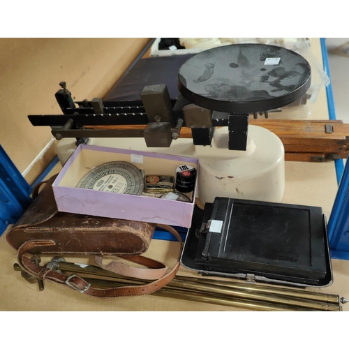 121a - A scientific balance scale; a 1930's Kodak camera; etc.