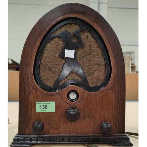 130 - A 1930's valve main s radio in walnut lancet top case; an Edwardian oak cased barometer and thermome... 