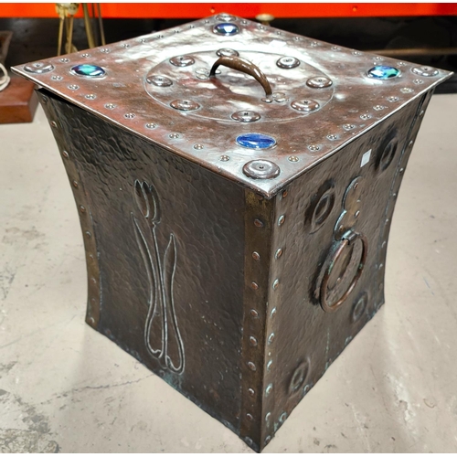 133 - An Arts & Crafts beaten copper coal bin with riveted decoration and jewelled mounts