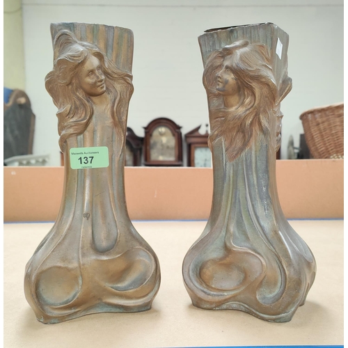 137 - An Art Nouveau pair of patinated bronze vases with female forms in relief, height 24cm