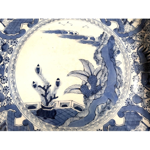 472 - A Chinese blue & white squared dish with indented corners, central traditional scene, mark to ba... 