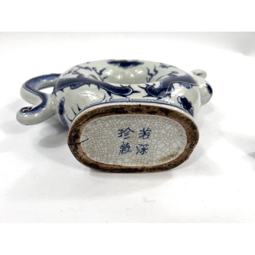 486 - A Chinese blue and white teapot with central hole and 4 character mark to base. HeightA Stone ware b... 