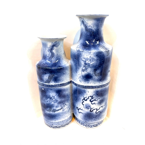 492A - An unusual Chinese blue and white conjoined larger and smaller vases decorated with bow in relief, d... 