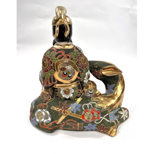 498A - A large early 20th century Japanese satsuma style figure of Jurojin sat atop a deer height 26cm